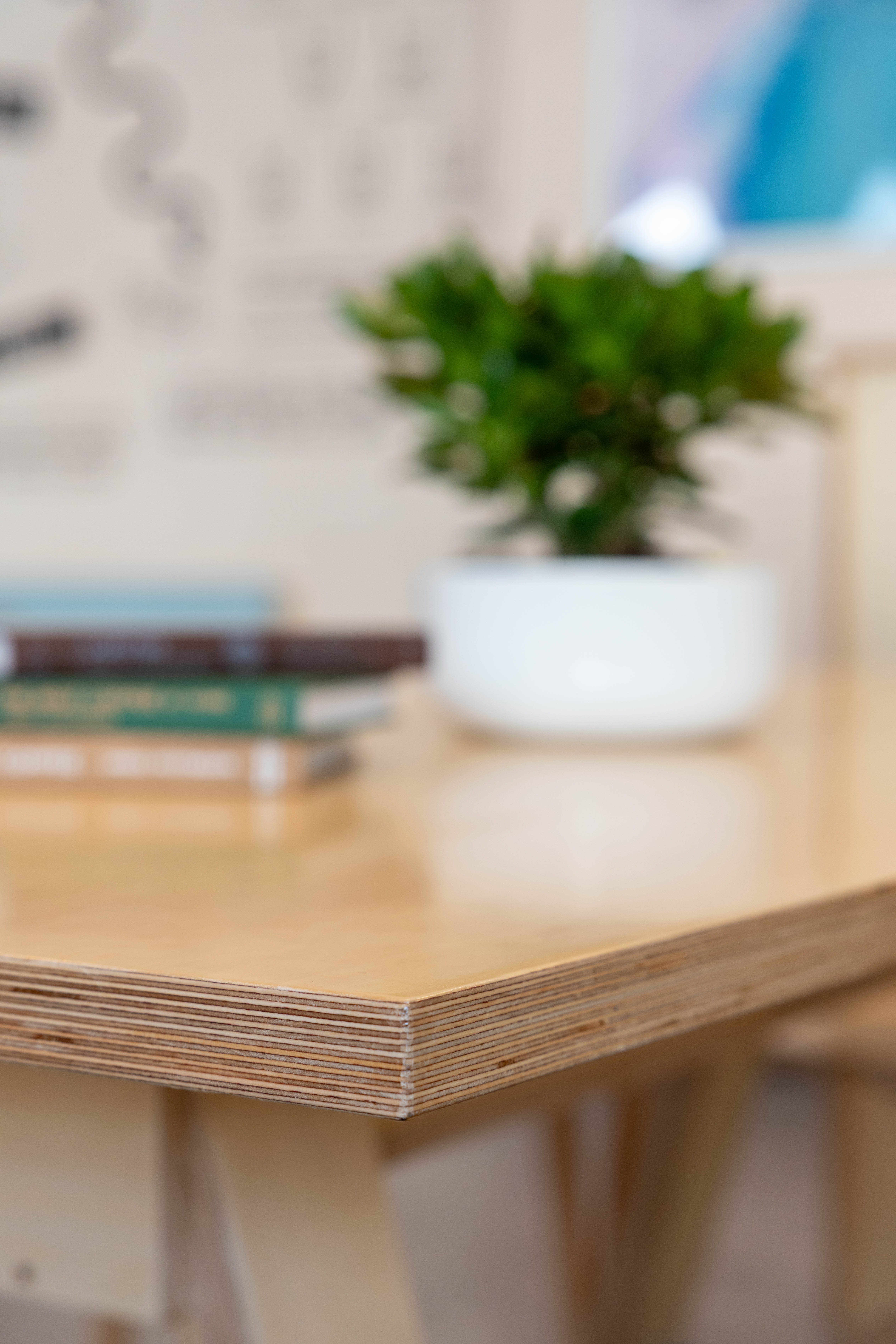 Exposed birch plywood laminations at the edge of a table top