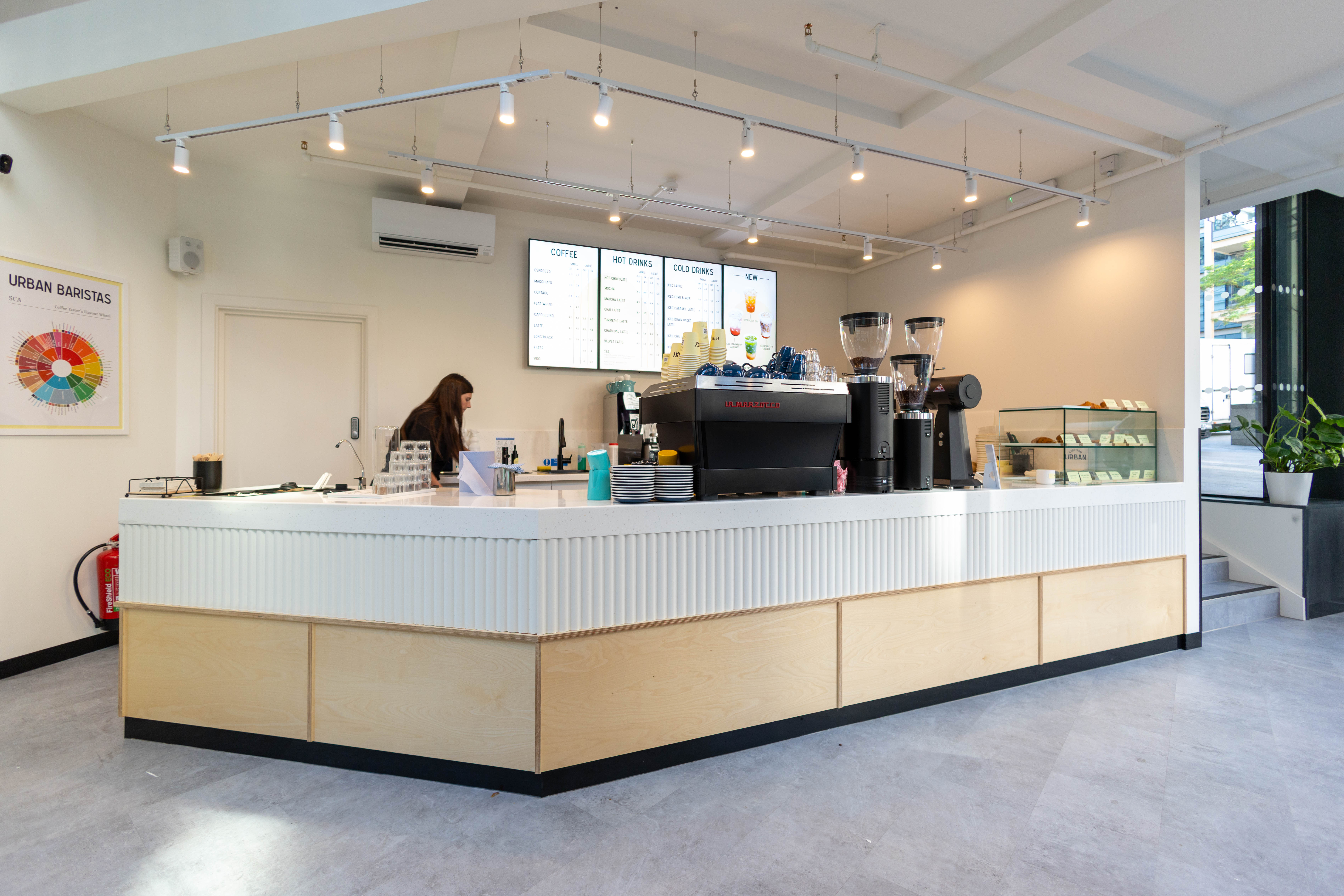 Fluted white counter front meeting the birch plywood plinth